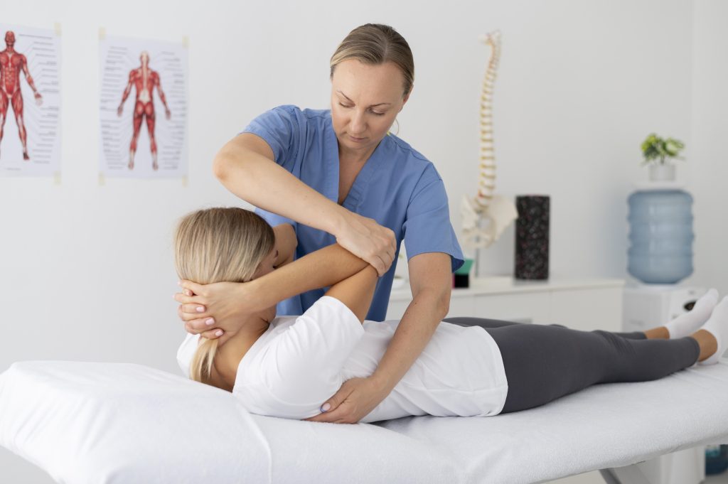 physiotherapist helping young female patient 2 Physiotherapy Cost in Dhaka